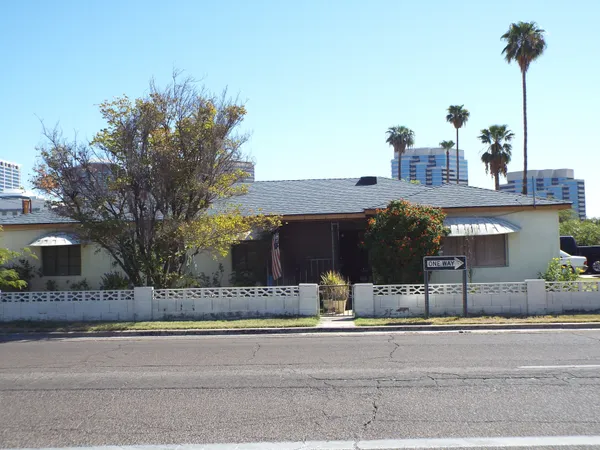 Man dies after being pinned under vehicle when car crashes into Phoenix home overnight